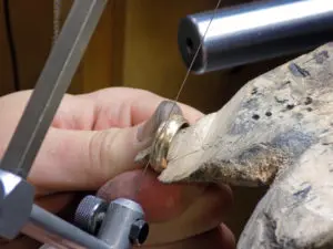 A person is working on a ring