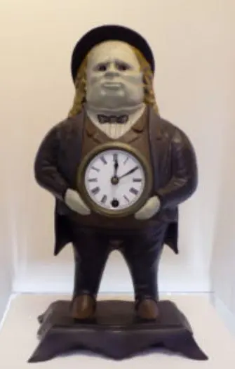 A statue of a man holding an alarm clock.