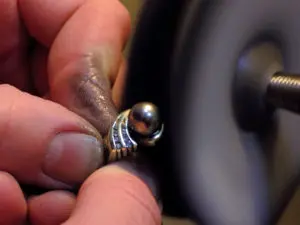 A person is working on a ring