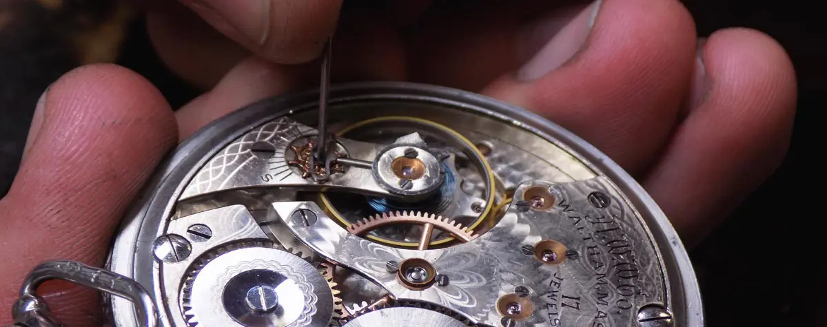 A person working on an old watch