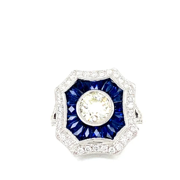 Luxurious gemstone ring with sapphire and diamond.