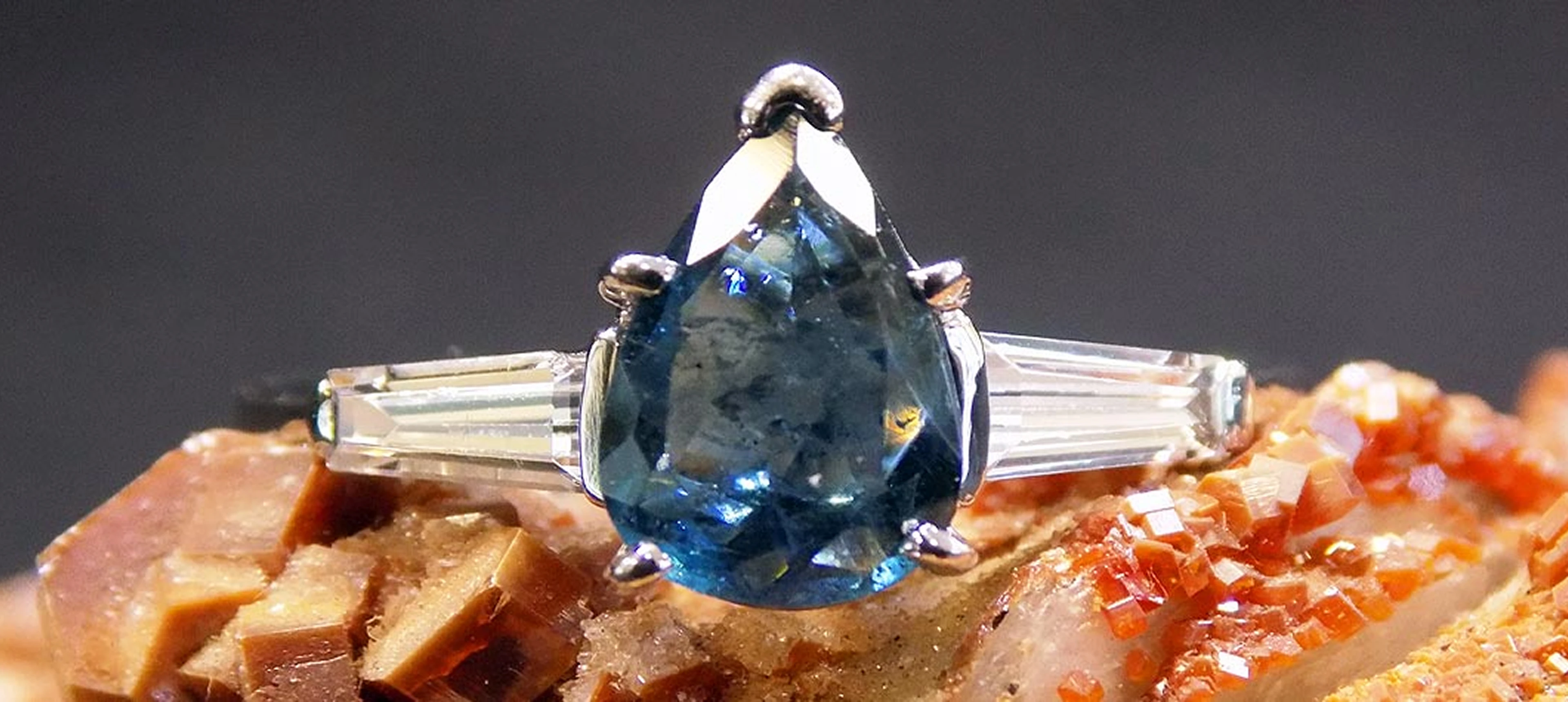 Blue gemstone ring with baguette accents