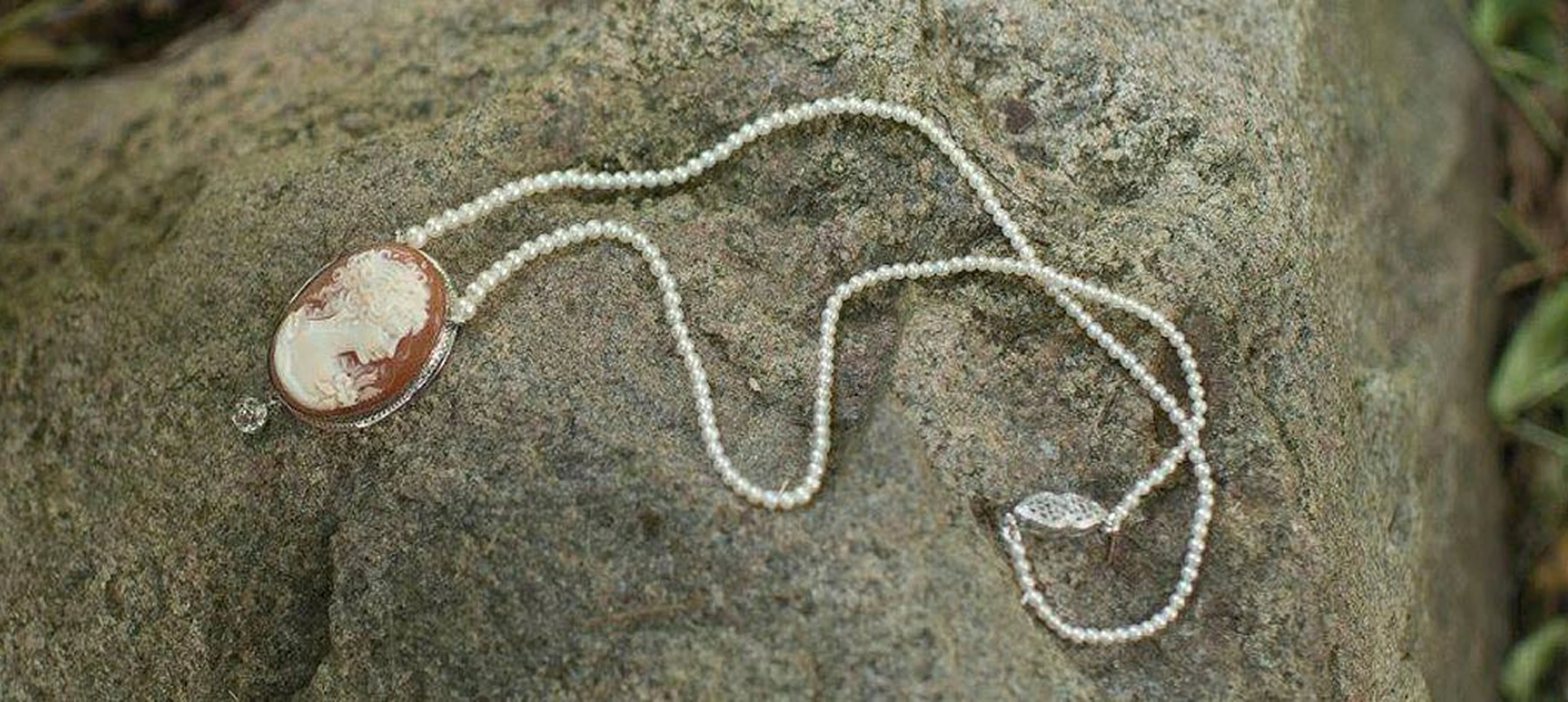 Elegant jewelry displayed on stone surface